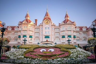 Disney Land Paris 1 Day Tour with Private Transportation Included - Entering Disneyland Paris through the main gate with tickets in hand