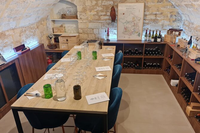 French Wine and Cheese Master Class Near the Eiffel Tower - Inside the delicatessen and the natural-stone cellar vibe