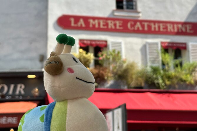 Montmartre - A Canvas of Art and History (Self-Guided audio tour) - Place du Tertre: artists, cafés, and watching the neighborhood perform