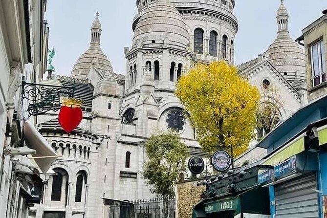 Montmartre guided walking tour with local guide in small group - The pink house and Place du Tertre: artist square energy, with context