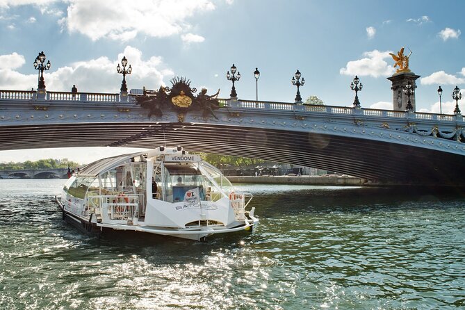 Paris: Batobus Hop-On Hop-Off Cruise & Landmarks Audio Tour - What it feels like on board (heated comfort meets river views)