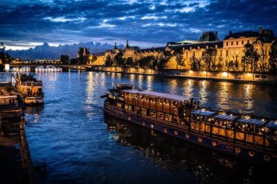 Paris By Night with Seine River Cruise and Roundtrip Luxury Transportation - Bateaux Parisiens: a glass-covered Seine cruise with real photo potential