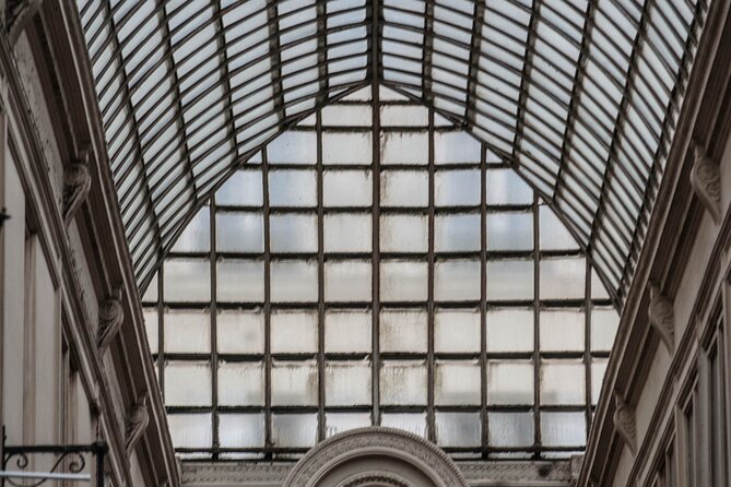 Paris Covered Passages Walking Tour plus Seine Cruise Option - Stop 4: Passage Jouffroy and the simple glass-and-iron lines