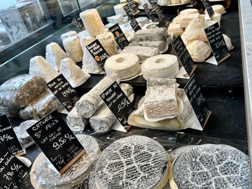 Paris: Guided Champagne & Food Tour in St-Germain-des-Pres - The shop-to-shop tasting: how the 6 delicacies create a full picture