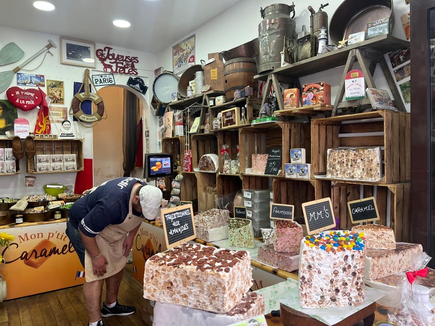 Paris: Guided Montmartre Walking Tour with Food & Wine - Place du Tertre: Artists, Street Energy, and Real Montmartre Atmosphere