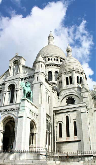 Paris: Montmartre hidden gems walking Tour with Local Guide - Moulin de la Galette: From Mills to Montmartre’s Artistic Identity