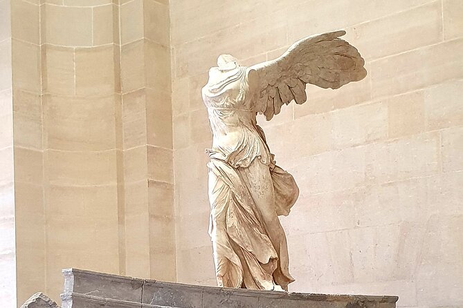 Paris Private Day Tour including Louvre Masterpieces Private Tour - Notre-Dame de Paris: a short stop that still gives you the right frame