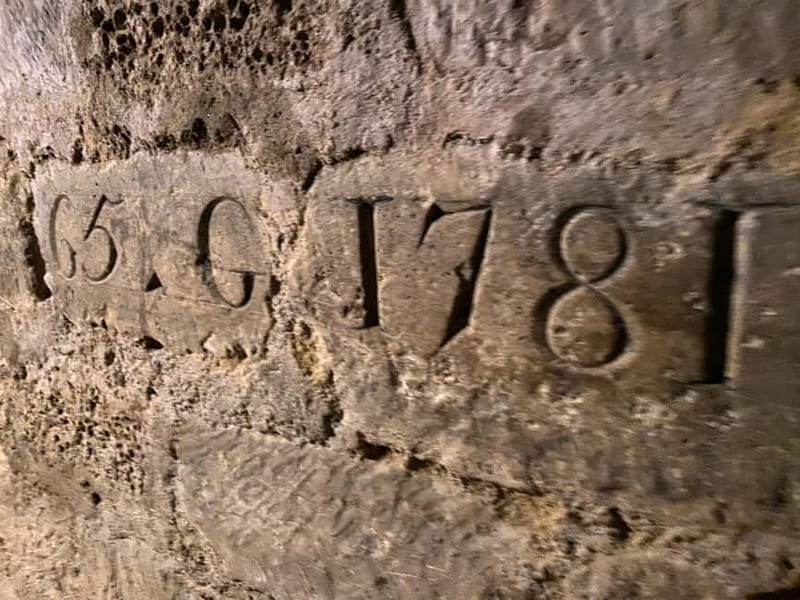 Paris: Small-Group Catacombs Tour with Skip-the-Line Entry - Cataphiles, graffiti, and the catacombs as a living underground