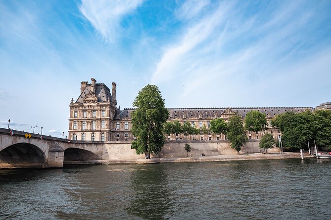 River Seine Sightseeing Boat Tour with Audio Guide - The Louvre Palace: From Royal Residence to World-Class Art