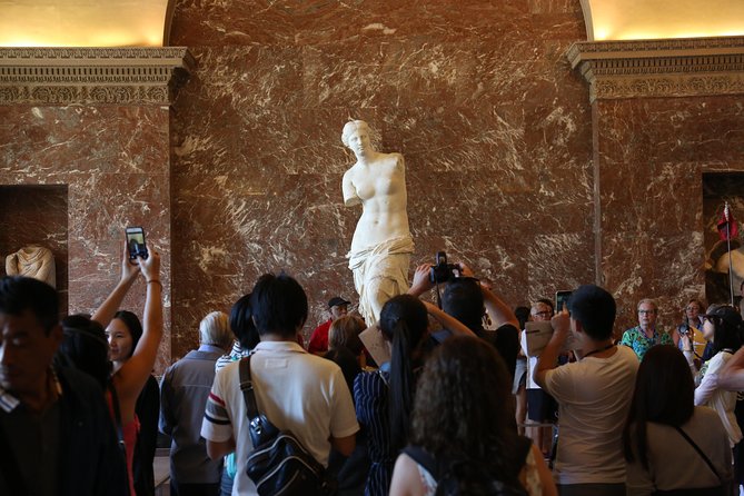 Small-Group Louvre Museum Masterpieces Tour with Access - Crowds, stairs, and hearing the guide in a huge museum