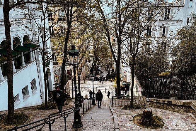 Walking Tour in Montmartre with a guide - Stop 4: Chateau dEau de Montmartre and a “why this hill matters” moment
